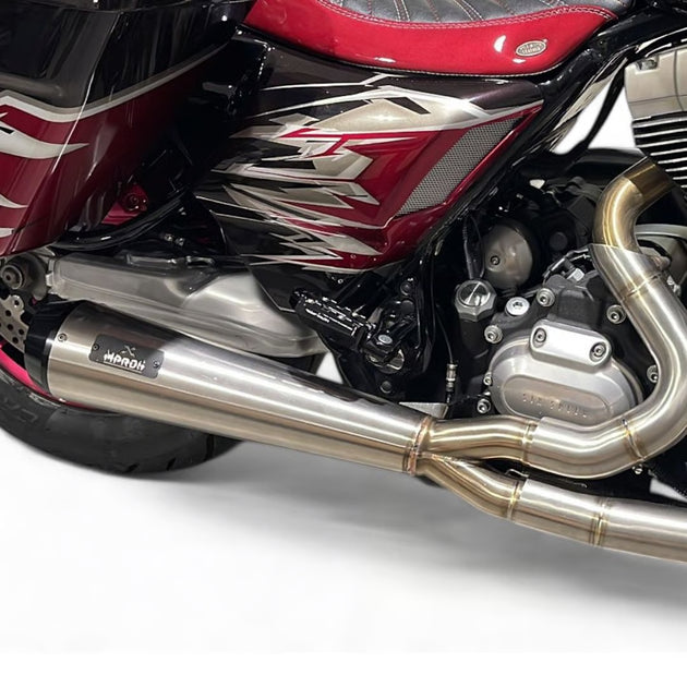 Close-up of a motorcycle exhaust system with a brand logo on a white background